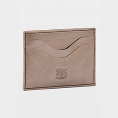 Il Bisonte "Salina" card case in vegetable-tanned metallic vachetta leather Exterior, four card slots and one slot for ID Lining: Unlined Approx. 2.8"H x 4.3"W x 0.5"D Item Weight (lbs.): 0.7 Made in Italy Elegant Leather Card Holder, Elegant Leather Card Holder With Coin Pocket, Elegant Leather Card Holder With Rfid Blocking, Rectangular Card Holder With Leather Lining For Gift, Rectangular Card Holder With Leather Lining, Rectangular Leather-lined Card Holder Gift, Leather Card Case, Metallic Leather, Card Case