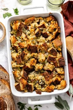 a casserole dish filled with bread and stuffing