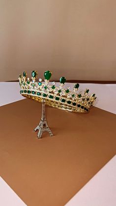 The MAJESTC EMERALD Green CROWN is one of our most luxurious Bridal Crowns with Stunning Design. It is inspired after Queen Victoria's crown. It is a Majestic Swarovski Bridal Crown that is timeless and classic to complete the bridal look. The design is made up of tear drop and round crystals with a unique design to give it the an outstanding look. It is a royal statement piece fit for a queen on her wedding day. Available as Regular Crown ( 3/4 crown) and Full Crown (full circle crown). Loops o Queen Victoria Crown, Green Crown, Wedding Headpieces, Boutique Couture, Crown Wedding, White Crystals, Bridal Crown, Wedding Crown, Headpiece Wedding