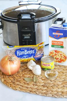 the ingredients for an instant pot roast are sitting on a mat next to an electric pressure cooker