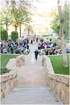 the bride and groom are walking down the aisle