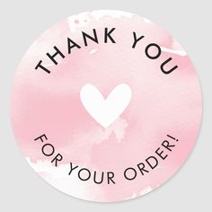 thank you for your order sticker with a heart in the center on a pink watercolor background