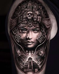 a woman's face with an intricate design on her arm and shoulder, in black and grey