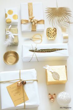 presents wrapped in white paper and gold foil