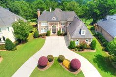 an aerial view of a large home in the suburbs