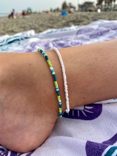 a person wearing a bracelet on the beach