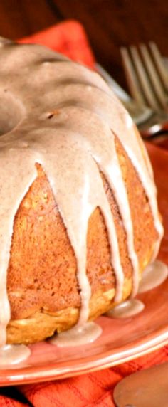 a bundt cake with icing on a plate