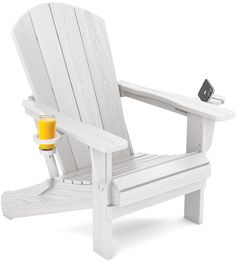 a white adiron chair with a drink on the armrest and an orange juice in front of it