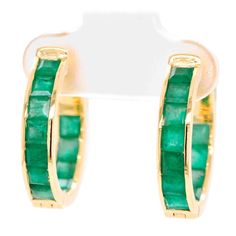 18k Gold Classic Square-Cut Emerald Hoop Earrings : Explore the timeless elegance of our Classic Emerald Hoop Earrings – a fusion of sophistication and allure. Crafted with meticulous attention, these exquisite pieces exude captivating charm that defies trends. Each hoop showcases meticulously chosen emerald gemstones, renowned for their lush green hue and enduring beauty. Set delicately within sterling silver hoops, they create a seamless fusion of luxury and refinement. Luxury Emerald Hoop Earrings, Luxury Yellow Gold Emerald Hoop Earrings, Luxury Classic Green Hoop Earrings, Square Cut, Emerald Gemstone, Sterling Silver Hoops, Lush Green, Silver Hoops, Timeless Elegance