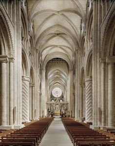 the inside of a church with rows of pews