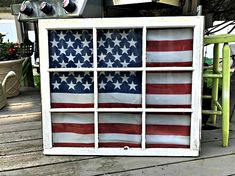 an old window painted with the american flag