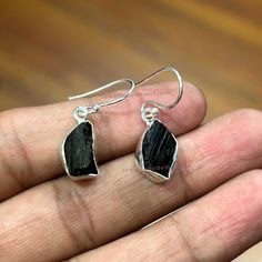 Natural Black Tourmaline Earring, Handmade 925 Silver Earring, Dangle Earring, Raw Black Tourmaline Drop Dangle Earring, Crystal Earring Offer Black Friday Christmas Halloween The stunning stone is the Natural Black Tourmaline WELCOME IN MY SHOP.. PRODUCT DESCRIPTION- Product - Gemstone Silver Earring Gemstone - Natural Black Tourmaline Stone size - Raw Stone Shape - Raw Type - Handmade Metal Purity - 925 Sterling Silver Ring Size - All Sizes Are Available Suitable For Everyday & Casual Wear.. This Will Make Special Attraction To The Wearer.. I Make My All Pieces With Passion A Lot Of Love.. This Will Enhance Your Personality.. I Gladly Accept Custom Orders, DM Me Freely.. SHIPPING POLICY :--------------------------------------------------------------------------------- Please Make Sure to Black Tourmaline Stone, Raw Black Tourmaline, Earring Dangle, Tourmaline Earrings, Earring Handmade, 925 Silver Earrings, Black Tourmaline, Silver Earring, Gemstone Earrings