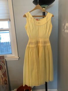 1950's butter yellow chiffon dress with wiggles and rhinestone details. Metal zipper up the back, which looks a little skewed (see photo). One or two rhinestones are missing, but that is hardly noticeable. A few little spots, but in really good shape otherwise. Being sold as isbust: 34/35 incheswaist: 24 incheships:  free (up to 60 inches)matching belt is up to 26" Yellow 1950s Sleeveless Dress, Yellow 1950s Style Sleeveless Dress, Yellow Sleeveless 1950s Dress, Yellow Vintage Dress For Vintage Events, Yellow 1950s Style Dress For Vintage Fashion, 1950s Style Yellow Dress For Vintage Fashion, Yellow Chiffon Dress, Raggedy Ann, Vintage 1950s