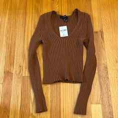 Ribbed Long Sleeve With Tags Never Worn V Neck Forever 21 Ribbed Tops For Winter, Fitted Ribbed Tops From Forever 21, Trendy Ribbed Tops From Forever 21, Trendy Brown Ribbed Crop Top, Forever 21 Fitted Brown Top, Ribbed Brown Crop Top For Fall, Fall Ribbed Brown Crop Top, Trendy Forever 21 Crop Top For Fall, Forever 21 Trendy Fall Crop Top