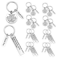 six keychains with different types of keys and words on them, one has a quote