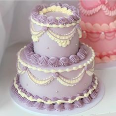 three tiered cake sitting next to each other on a table