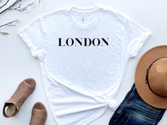 London T-Shirt, England Trip Shirt, Traveller Shirt, London Travel Gift, England Shirt, London Graphic T Shirt Women, Unisex Tee This listing is for one premium T-Shirt - 100% Airlume Combed and Ringspun Cotton  Unisex t-shirt, which is extremely soft and comfortable to wear. This is the perfect shirt for the one you love!  Our T-Shirts are high quality, super soft, and comfy. Made with top-of-the-line vinyl and pressed with a professional-grade heat press. Please be advised before your order. T London Tshirt, England Shirt, London Gifts, London Trip, England London, Travel Shirts, London Travel, Perfect Shirt, London England