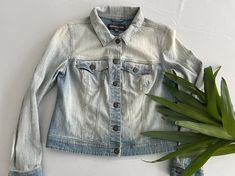 "Nice light washed denim jacket by Reitmans of Canada.  An easy piece to mix in to everyday looks or the perfect jacket to throw on over a dress. 98% cotton with 2%   Marked !2 Petite fits XS/S Chest 17\" Waist 18\" Sleeve 24\" Length 20.5\" Shoulders 15\" Nice conditon; shows little to no signs of wear." Faded Button-up Denim Jacket For Spring, Spring Faded Button-up Denim Jacket, Casual Faded Denim Jacket For Spring, Light Wash Distressed Cotton Denim Jacket, Light Wash Cotton Button-up Denim Jacket, Light Wash Denim Jacket, Perfect Jacket, Washed Denim, Light Wash Denim