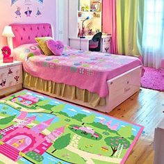 a child's bedroom decorated in pink, green and yellow with princess rugs on the floor