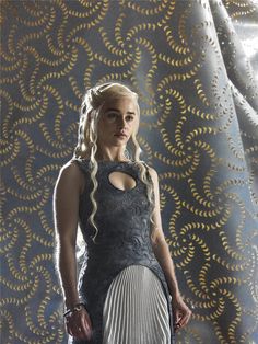 game of thrones'daeneress starke is standing in front of a curtain