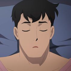 a man sleeping in bed with his eyes closed while wearing a pink shirt and black hair