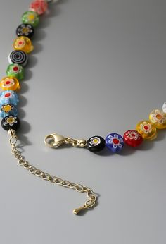 Trendy and colorful  	 Daisy pendant Trendy Colorful Jewelry With Large Beads, Multicolor Letter Beads Jewelry, Multicolor Letter Beaded Jewelry, Trendy Colorful Necklaces With Round Beads, Casual Multicolor Round Beads Necklaces, Casual Multicolor Round Bead Necklaces, Casual Yellow Beaded Chain Jewelry, Casual Multicolor Beaded Jewelry, Colorful Beaded Necklaces With Letter Beads