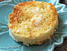 a close up of a piece of bread on a blue plate with crumbs