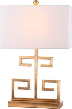 a table lamp with a white shade on it and a gold frame around the base