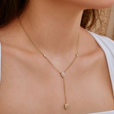 Elevate your look with this stunning minimalist lariat necklace, featuring delicate teardrop-shaped lab-created diamond designs. Crafted from 925 sterling silver and plated with luxurious 18-karat gold, this piece offers a sleek, modern touch to any outfit. The adjustable back allows for versatile styling, whether you wear it alone or layered with your favorite pieces. Perfect for any occasion, this necklace adds a hint of elegance and sparkle, while the lab-created diamonds provide a sustainabl Droplet Necklace, Necklace Luxury, Gold Lariat Necklace, Anklet Bracelet, Evil Eye Necklace, Lariat Necklace, Diamond Design, Kids Jewelry, Eye Necklace