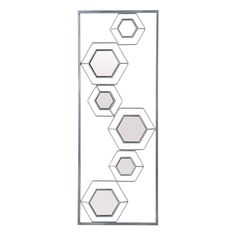 three mirrors are hanging on the wall in front of a white background with hexagonal shapes