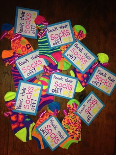 there are lots of socks on the floor with tags around them that say sock day