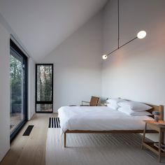 a bedroom with a large bed sitting next to a window