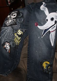 a pair of jeans with patches on them