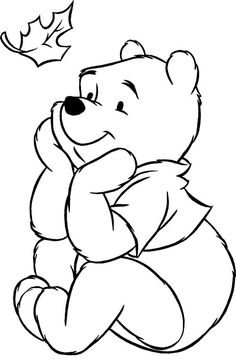 a black and white drawing of a teddy bear sitting on the ground with a leaf flying in the air