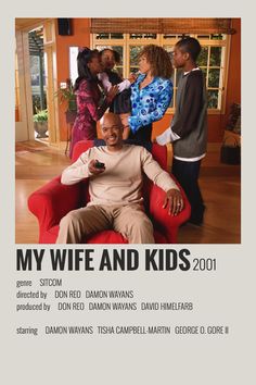 the poster for my wife and kids is shown in front of two children sitting on a red chair