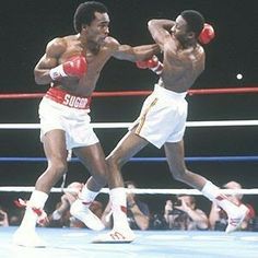 two men in boxing stance during a match