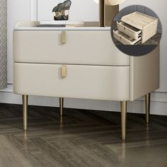 a dresser with two drawers and a mirror in front of it on a wooden floor