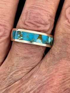 "This beautiful ring by Studio GL has inlay of Turquoise. The ring is signed and stamped .925 for being sterling silver. This ring was designed by G.L. Miller and his Studio GL made the ring in Albuquerque, New Mexico. GL Miller has received National and International awards for his original designs. His major interest lies in designing contemporary one of a kind jewelry influenced by Ethnic American Indian Designs and Western Geometric Patterns. The ring weighs 9.10 grams The band is 1/4\" inch Southwestern Style Polished Turquoise Ring, Southwestern Polished Turquoise Ring, Southwestern Polished Turquoise Ring Collectible, Southwestern Style Polished Ring Jewelry, Southwestern Inlay Jewelry For Anniversary, Southwestern Style Inlay Jewelry For Anniversary, Southwestern Style Jewelry With Polished Finish For Anniversary, Southwestern Style Polished Jewelry For Anniversary, Artisan Rings With Inlay For Anniversary