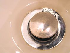 a close up of a metal object in a sink