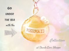 a necklace with the words mermaid written on it and an image of a sea shell