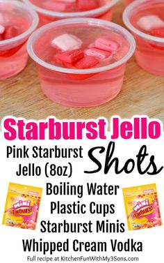 pink starburst jello shots in plastic cups on a wooden table with text overlay