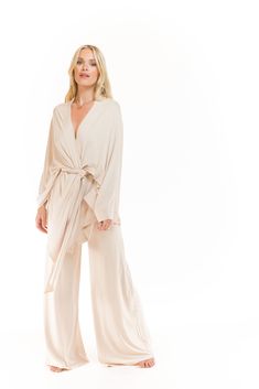 Our timeless and elegant Japanese-inspired Kimono is a perfect addition to any wardrobe. Made from super soft bamboo material, this versatile design is perfect for layering and comfort. It comes with a soft bamboo belt that can be worn as an optional extra, allowing for different styling options. This Kimono brings a peaceful warrior feel to the collection, and its loose fit is great for all shapes and sizes. Pair it with our palazzo pants or side slit skirt for a modern 1920s feel lounge wear look. Shop now and experience the perfect blend of style, comfort, and sustainability. Kimono Loungewear, Peaceful Warrior, Trend Board, Bamboo Material, Contemporary Outfits, Kimono Jacket, Palazzo Pants, Divine Feminine, Yoga Wear