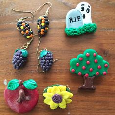 some fruit and vegetables are sitting on a wooden table next to each other, including an apple