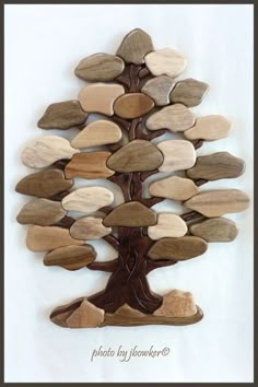 a tree made out of wooden pieces on a white background