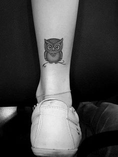 an owl tattoo on the ankle