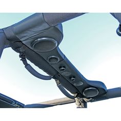 a close up view of the handlebars on a bike with blue sky in the background