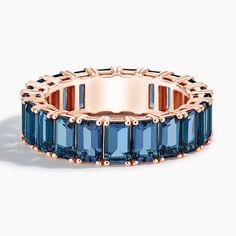 a rose gold ring with blue stones