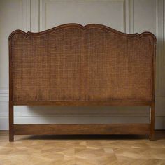 the headboard is made out of wood and wicker