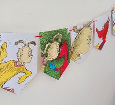 dr seuss and the cat in the hat buntings are hanging on a wall