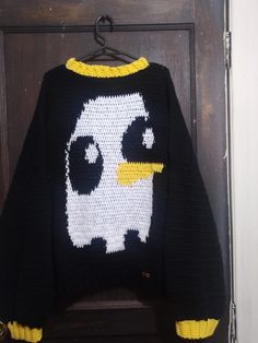 a knitted sweater with an angry bird drawn on it